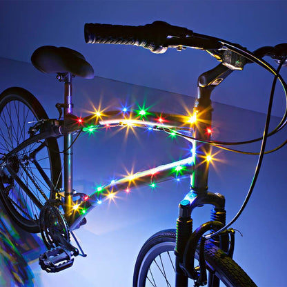 Luz LED para cuadro de bicicleta Brightz encendida de noche con efecto multicolor