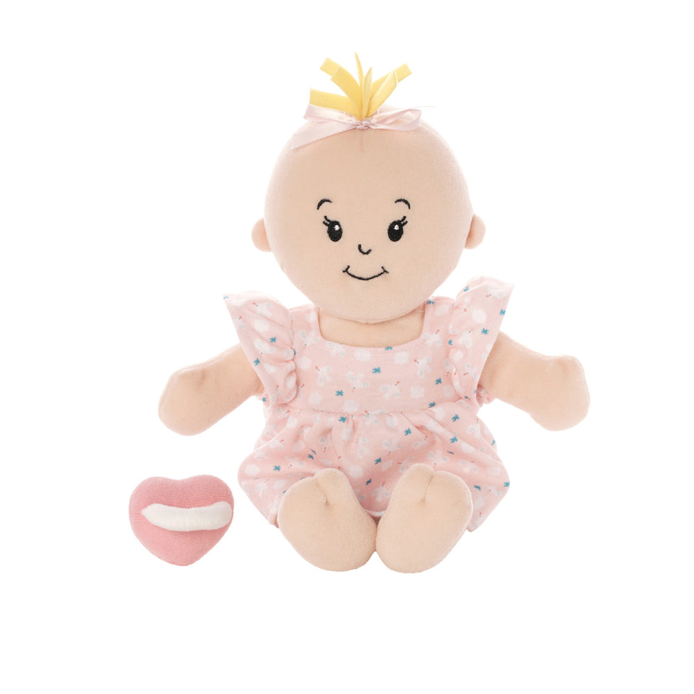 muñeca Love Stella Peach con mechón sentada con chupete magnético
