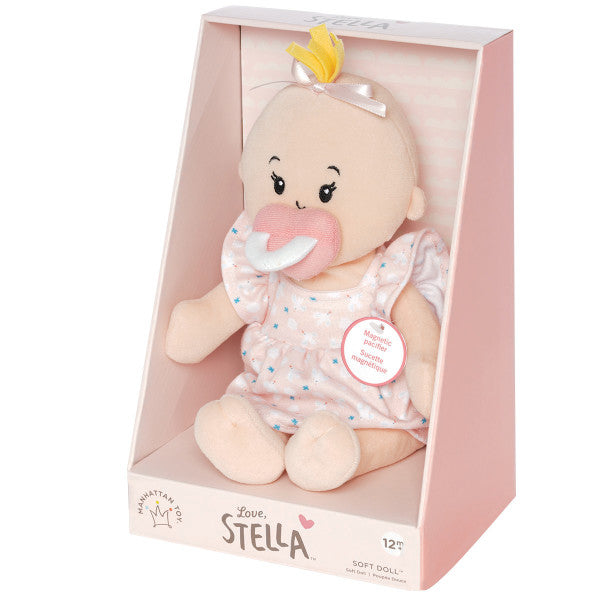 caja de la muñeca de tela Peach Love Stella con mechón rubio y vestido rosa Manhattan Toy
