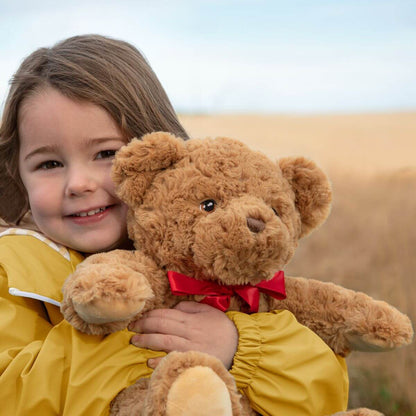Oso de peluche con lazo rojo