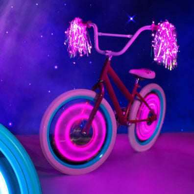 Tubos luminosos para radio de bicicleta infantil Brightz rosa encendidos en la rueda