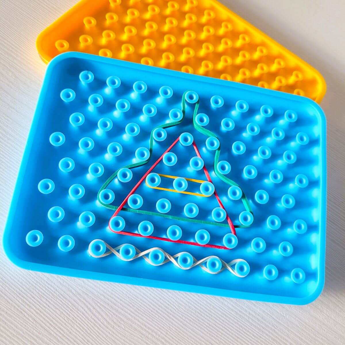 Juguete sensorial de silicona de color azul para aprender formas de lectoescriptura para niños  y niñas a partir de 3 años